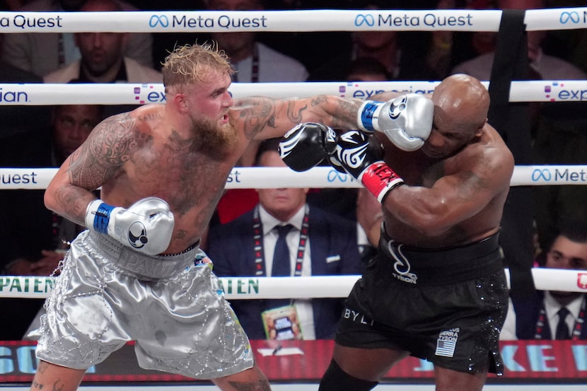 Jake Paul lands a left to Mike Tyson during their heavyweight boxing match, Friday, Nov. 15,...