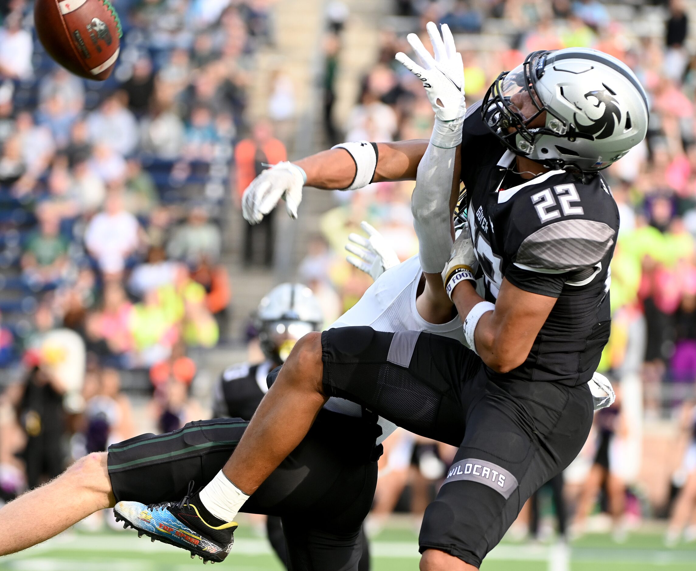 Denton Guyer's Peyton Bowen (22) breaks up a pass intended for Prosper's Houston Hawkins (4)...