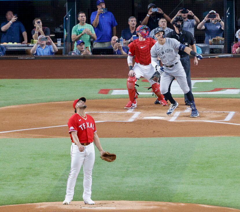 New York Yankees right fielder Aaron Judge (99) hits a home run to left field as Texas...