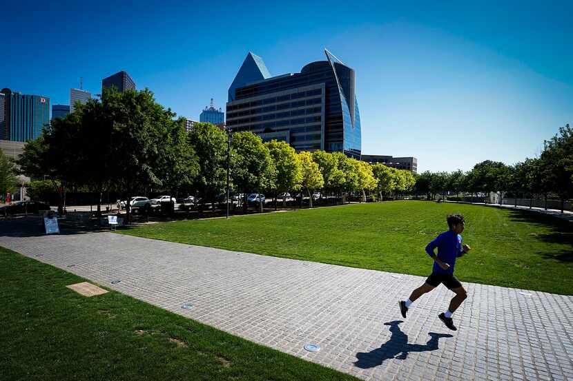 A runner has room to glide through Klyde Warren Park in Dallas.
