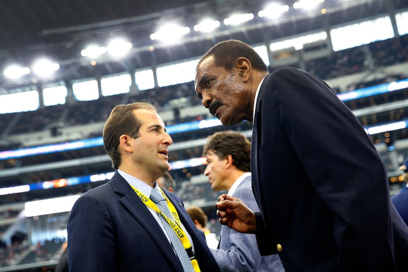Dallas Cowboys general counsel Jason Cohen (left) visited with former Cowboy Calvin Hill on...