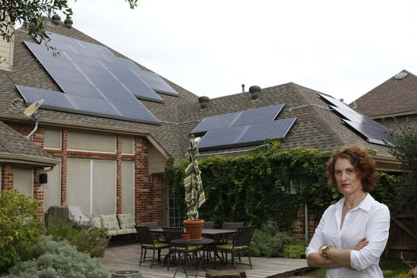 Lauren Doherty's 33 roof solar panels comply with Allen's ordinance because they are on the...