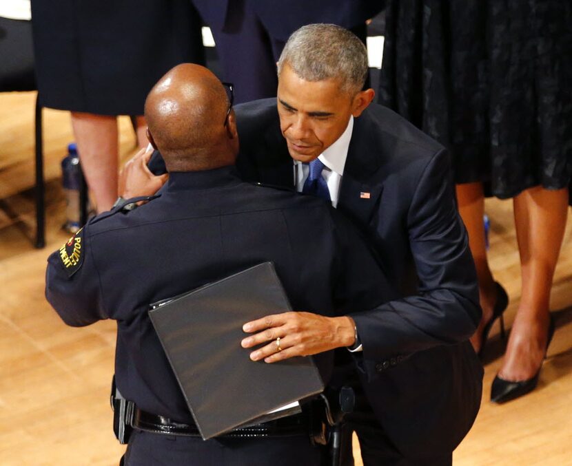 President Barack Obama hugged Brown after the chief spoke at a memorial service for the five...