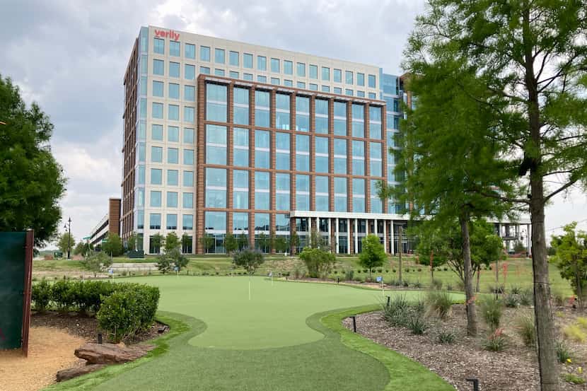 A new putting green is in front of the first high-rise office built in Billingsley Co.'s...