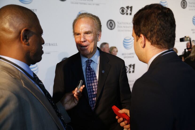 Roger Staubach talks to media during National Football Foundation Hall of Fame event at Omni...