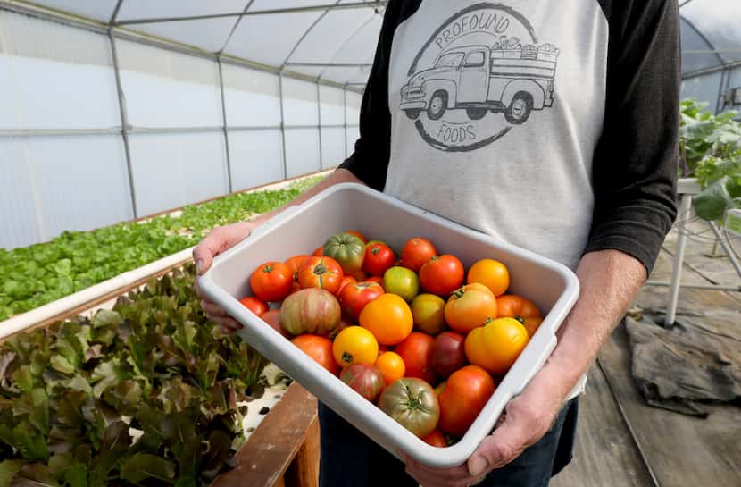 Jeff Bednar, founder of Profound Microfarms and Profound foods, holds a container of...