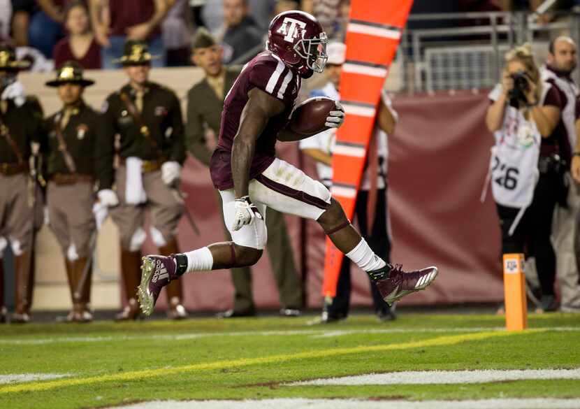 Texas A&M running back Keith Ford (7) skips over the goal line for a touchdown after a 12...