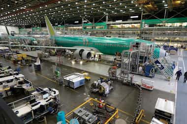 In this Tuesday, Dec. 16, 2014, photo, Boeing 737-800 airplanes are on the assembly line at...