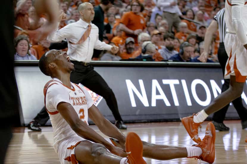 Texas guard Matt Coleman III (2) screams after taking a charge by a Colorado player during...