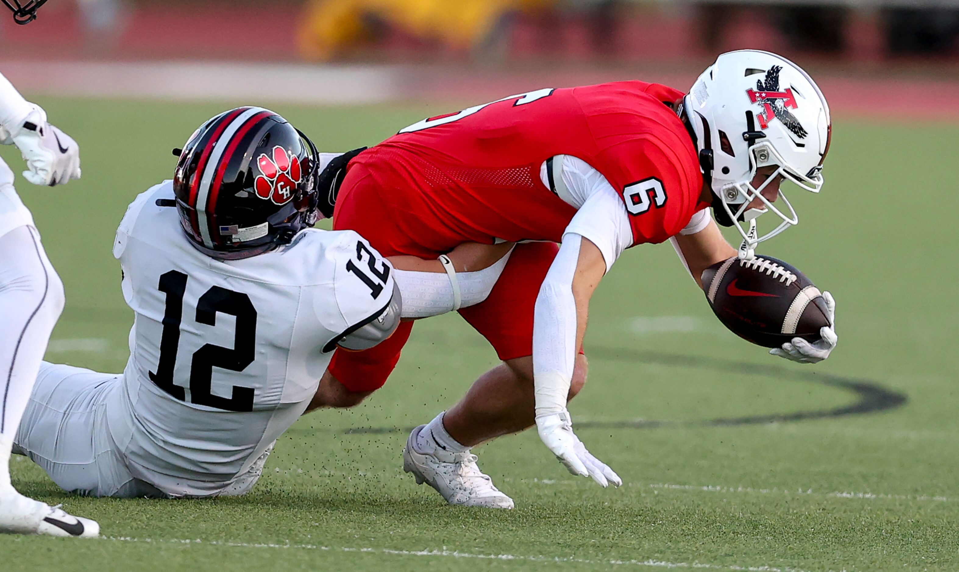 Argyle running back Watson Bell (6) is tackled by Colleyville Heritage linebacker Dax...