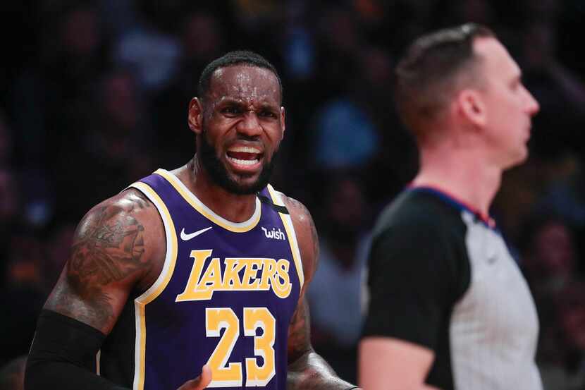 The Los Angeles Lakers' LeBron James takes exception with an official's ruling in the second...