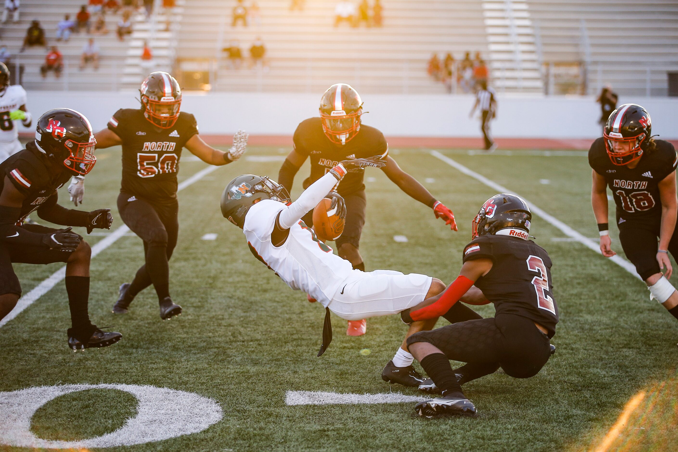 North Garland sophomore linebacker Toderick Jones (2) tackles Garland Naaman Forest senior...