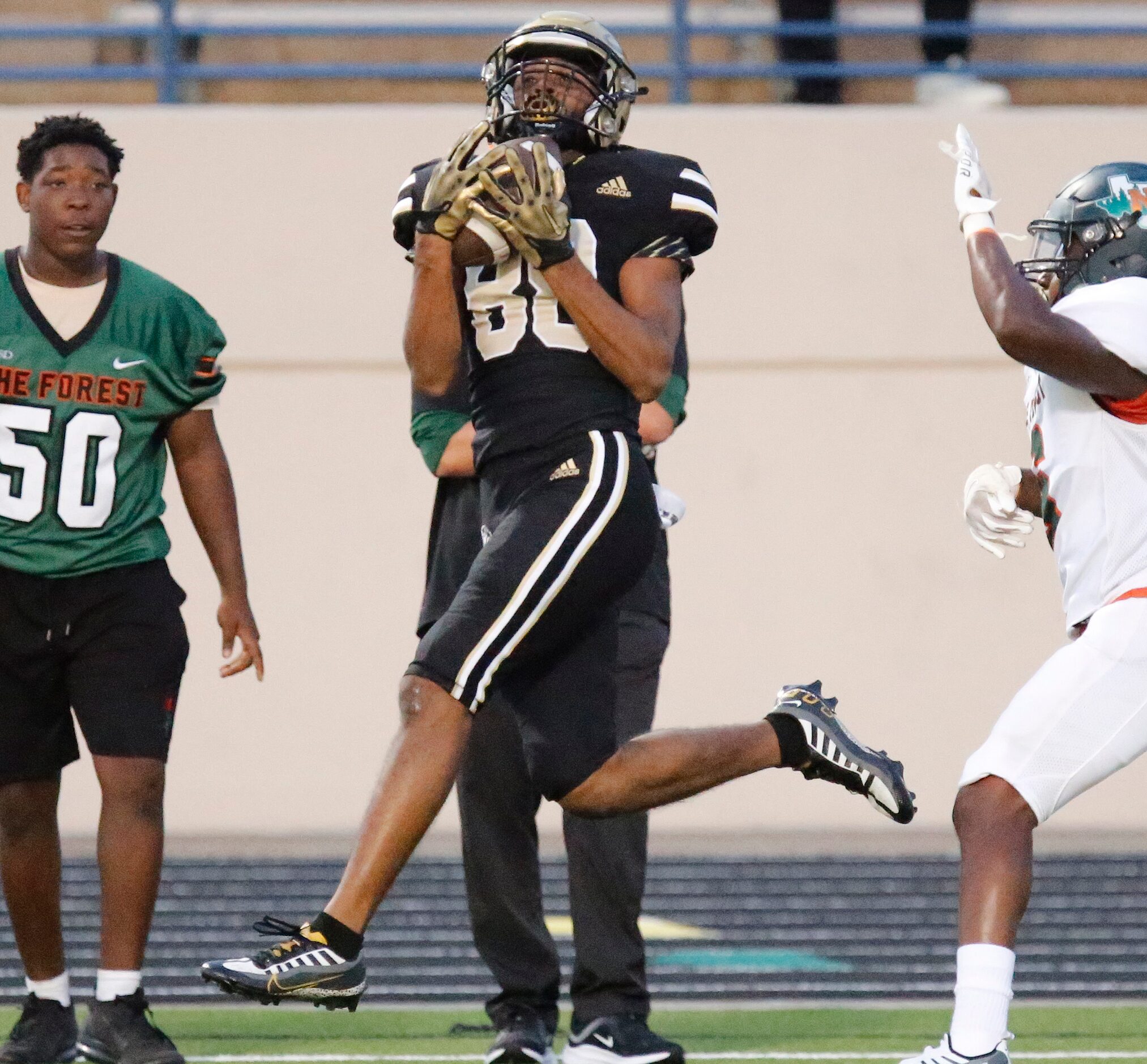 Plano East Senior High School wide receiver Rushil Patel (88) catcher a deep pass during the...