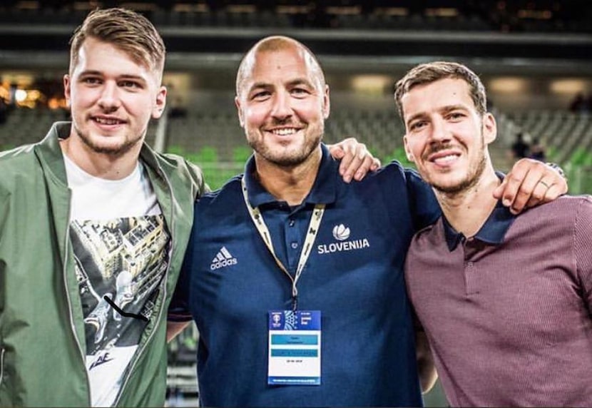 Luka Doncic, Marko Milic and Goran Dragic pose for a photo with the Slovenian national team....