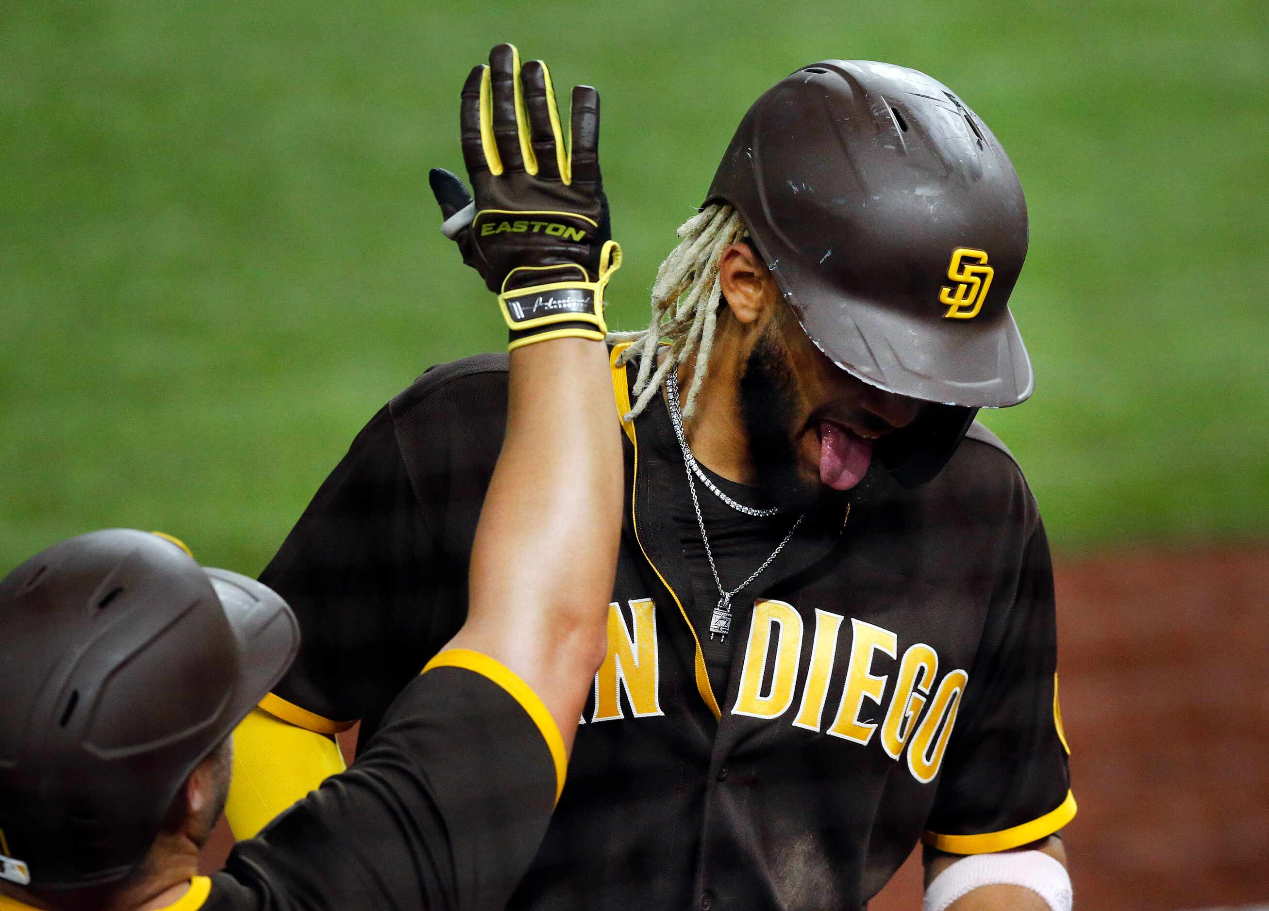 San Diego Padres Fernando Tatis Jr. (23) sticks out his tongue after his eighth inning grand...