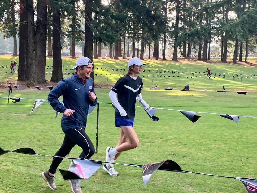 Trace Greer helps his brother Judson warm up for the 2019 Nike Cross Nationals. Judson, a...