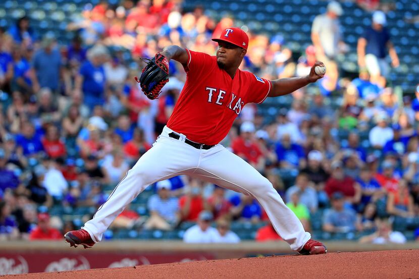 ARLINGTON, TX - JUNE 15:  Yohander Mendez #65 of the Texas Rangers pitches against the...