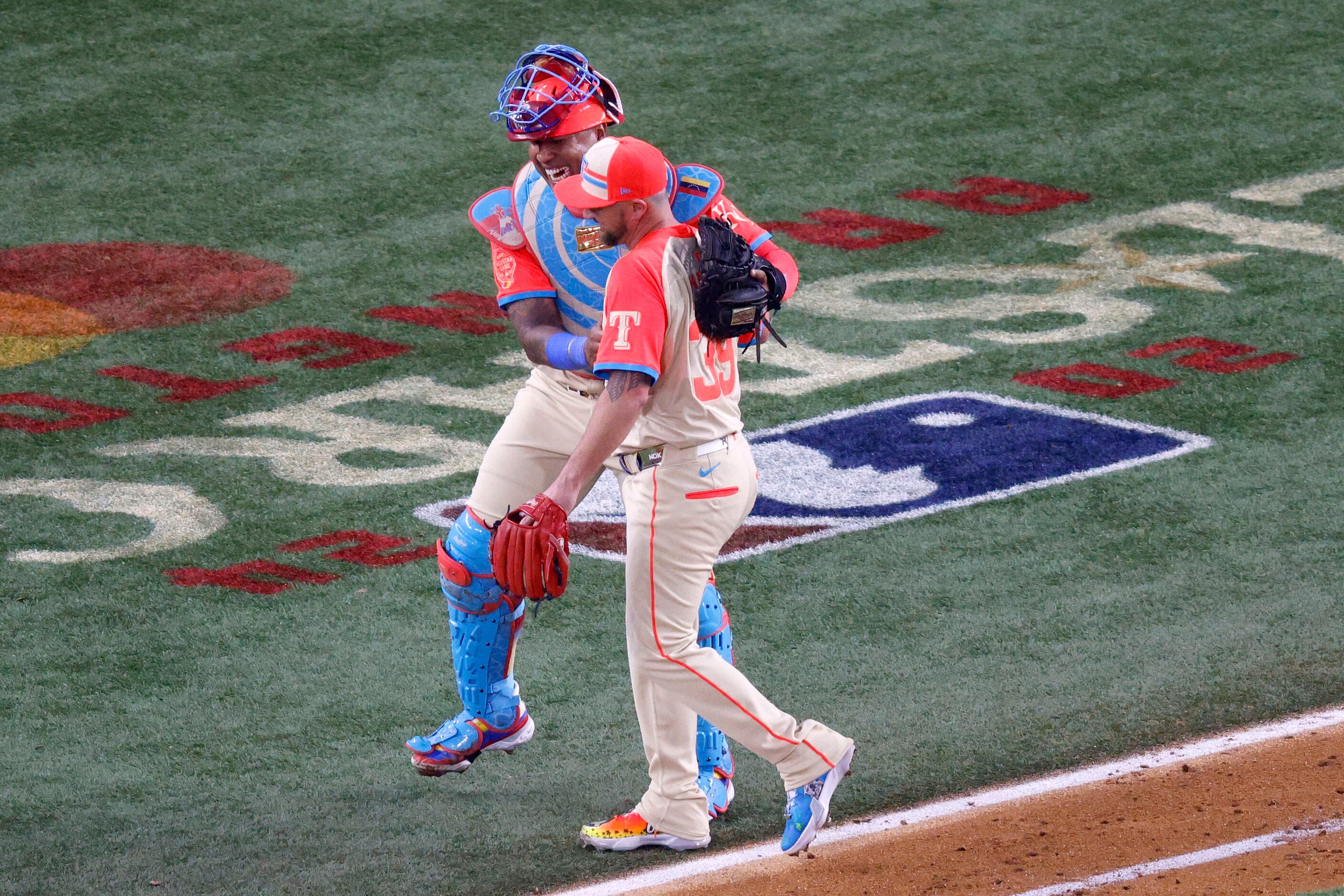 American League catcher Salvador Perez of Kansas City Royals (13) and American League...