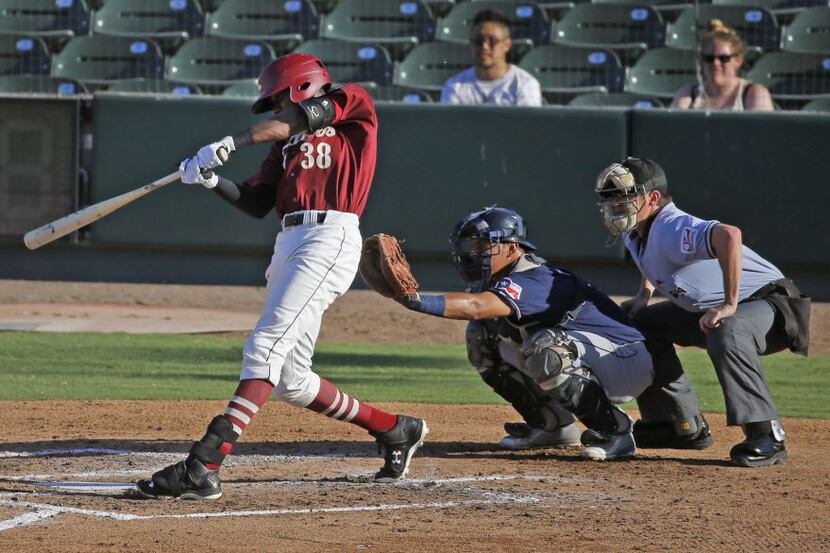 Outfielder Lewis Brinson makes contact during the Frisco RoughRiders against the San Antonio...