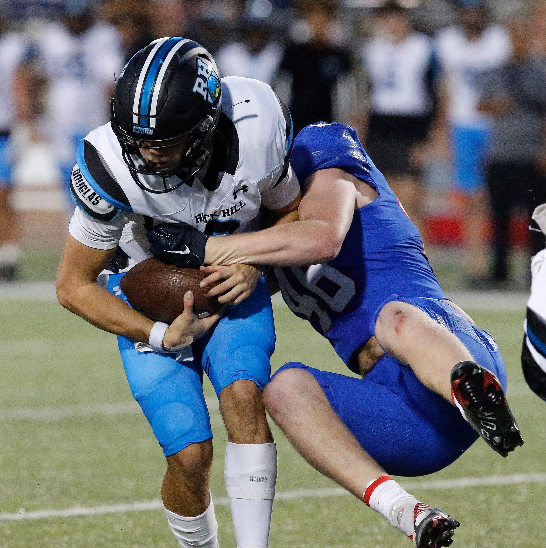 Allen High School defensive end Brock Winsett (46) gets a sack on Rock Hill High School...