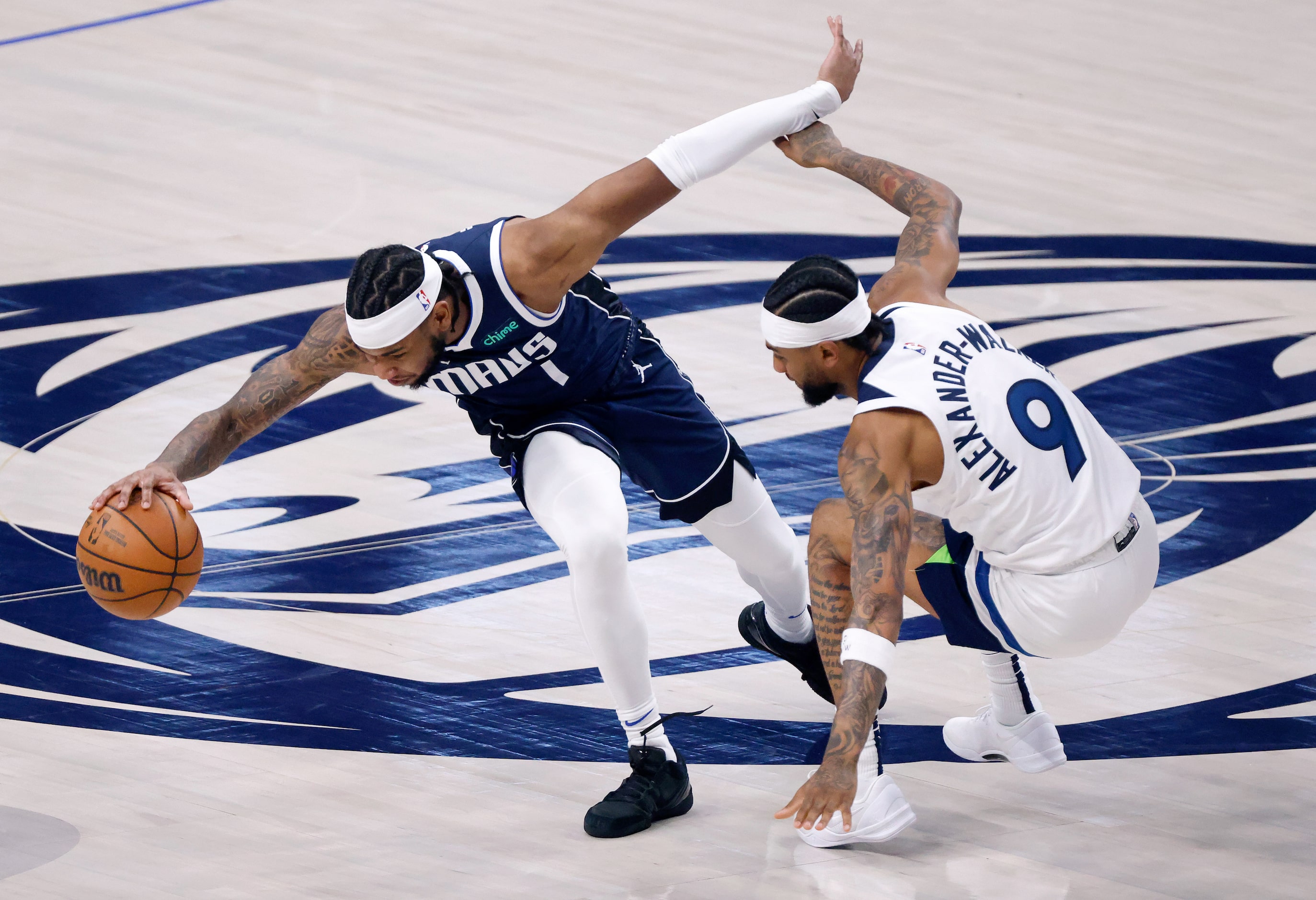 Dallas Mavericks guard Jaden Hardy (1) tries to control the ball as Minnesota Timberwolves...