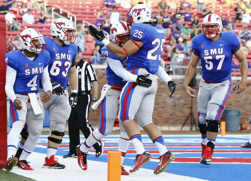 SMU running back Xavier Jones (10) and running back K.C. Nlemchi (25) along with quarterback...