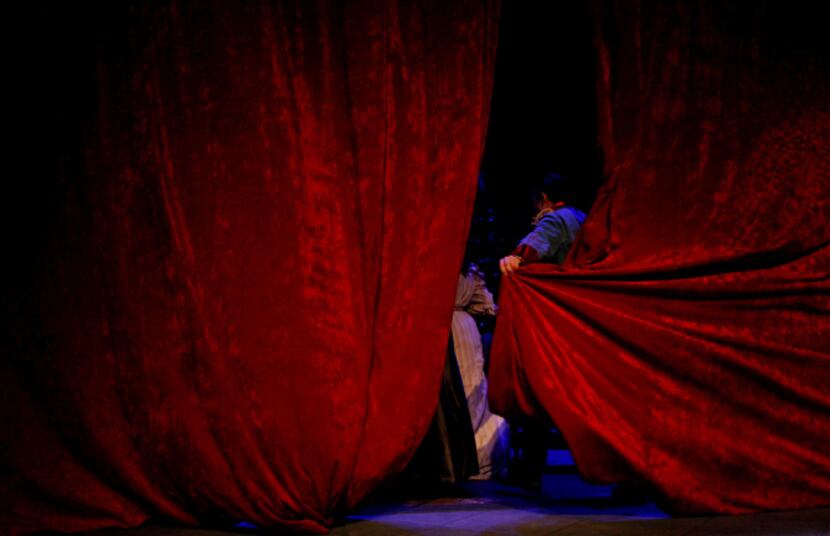 Christian Genco as Simon Bright pulls the curtain during the Ken Ludwig's The Game's Afoot,...