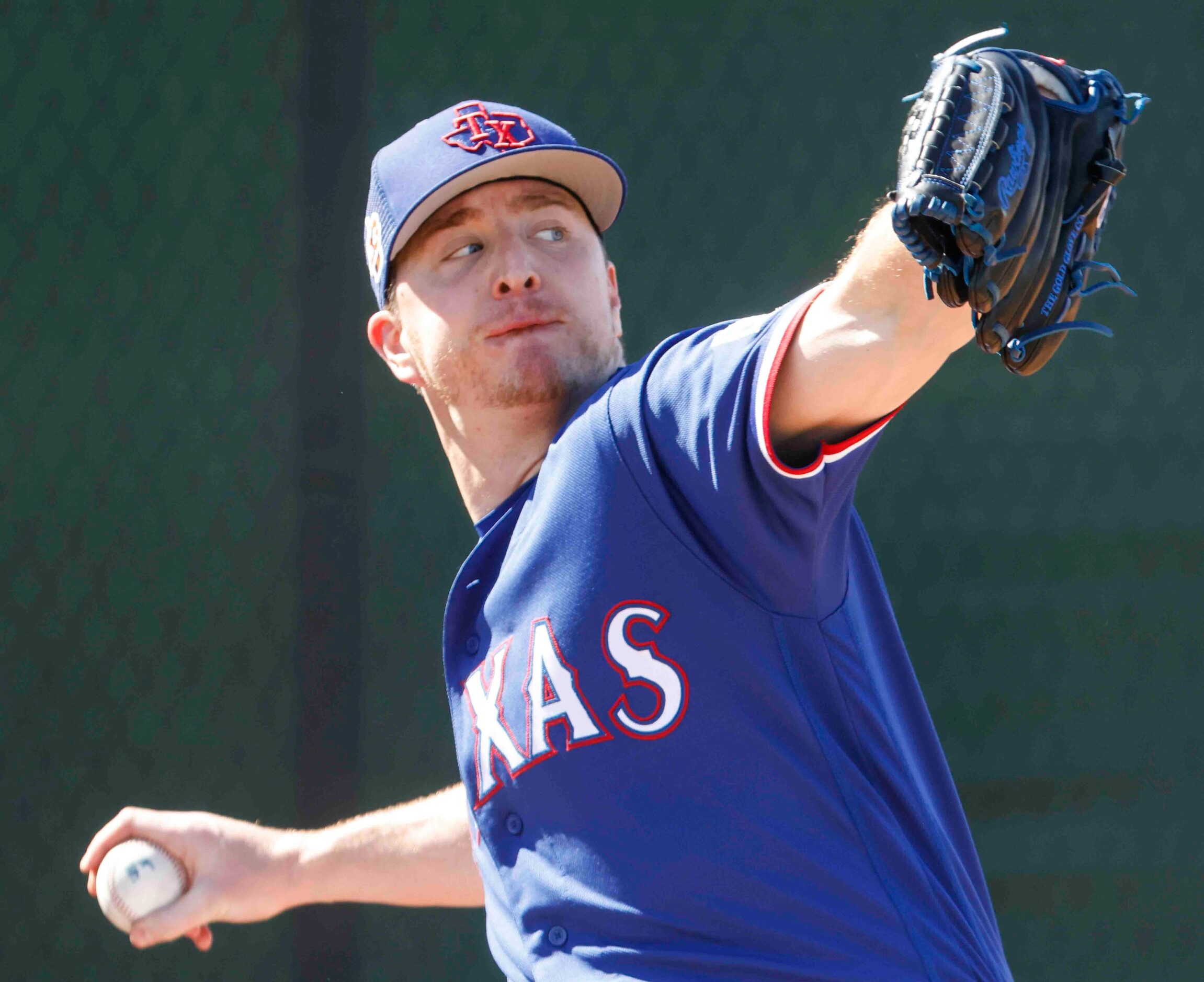 Texas Rangers pitcher Josh Sborz throws a pitch during a spring training workout at the...