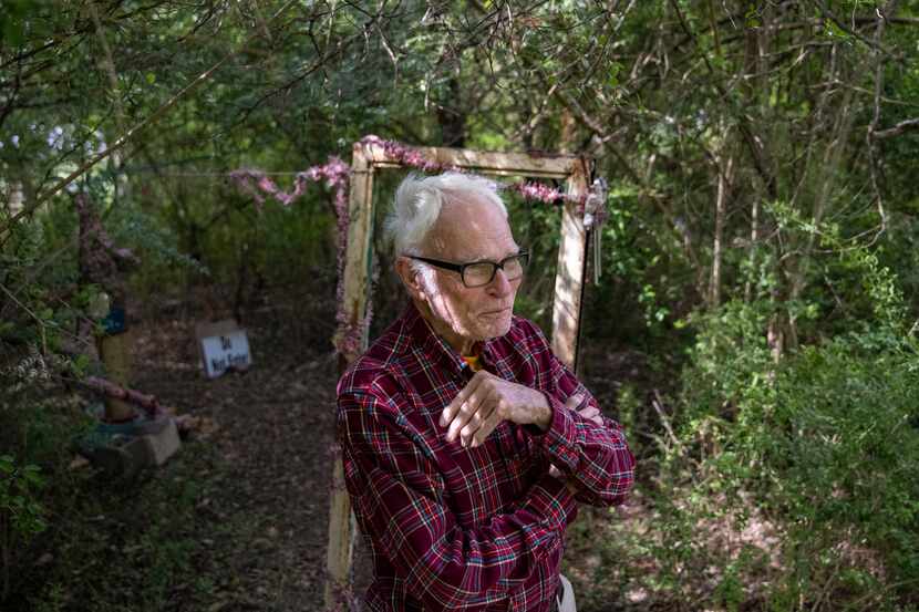 The Rev. Timothy Gollob stands Tuesday in the Oak Cliff backyard where he keeps a trove of...