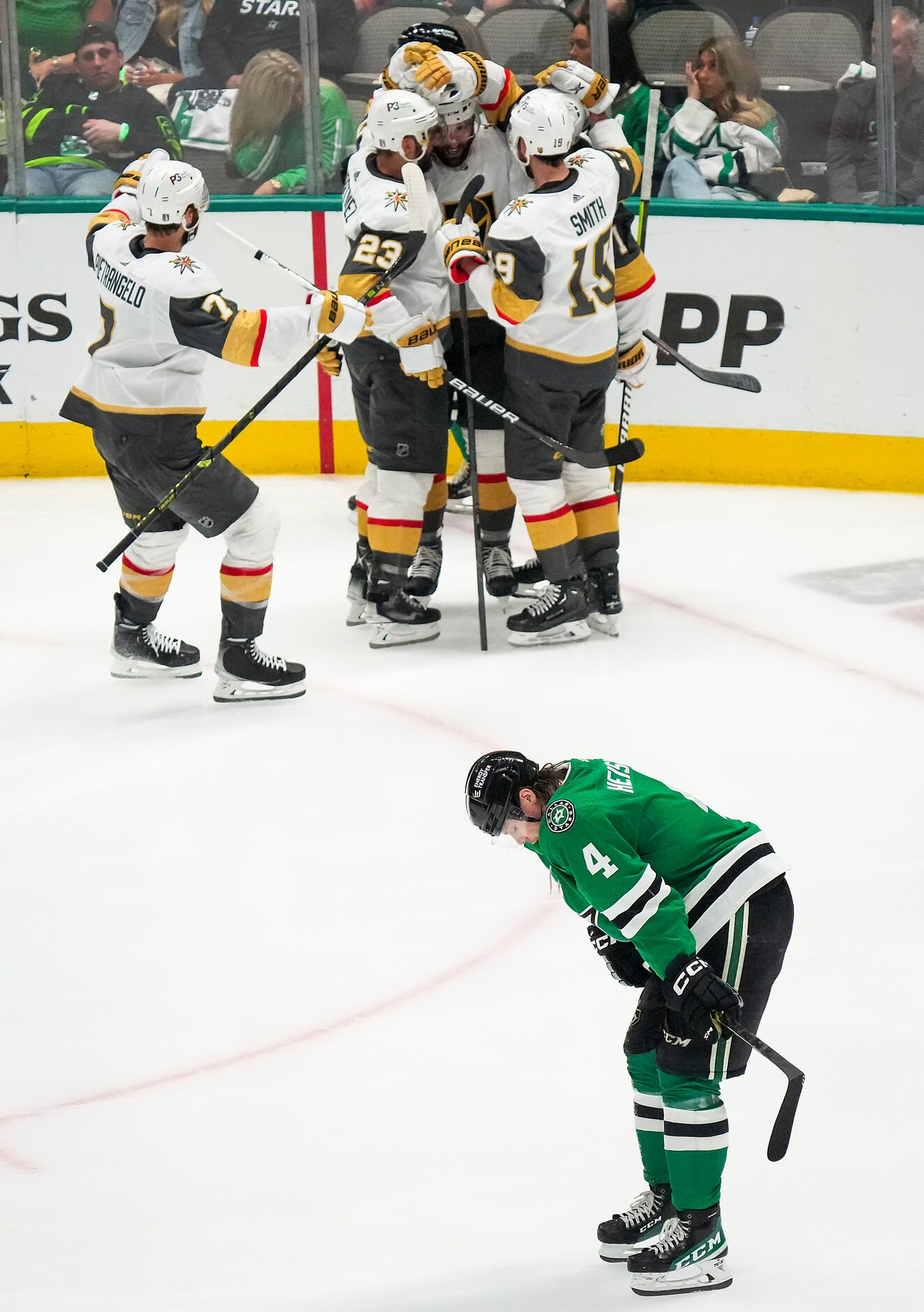 Dallas Stars defenseman Miro Heiskanen (4) looks away as Vegas Golden Knights players...