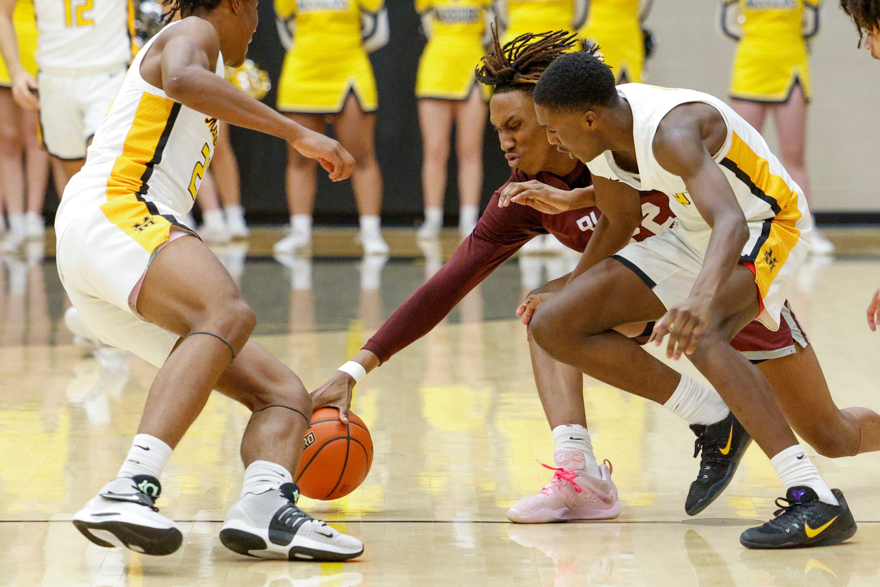 Frisco Memorial guard Javuan Henderson (left), forward Leon Horner (right) and Plano forward...