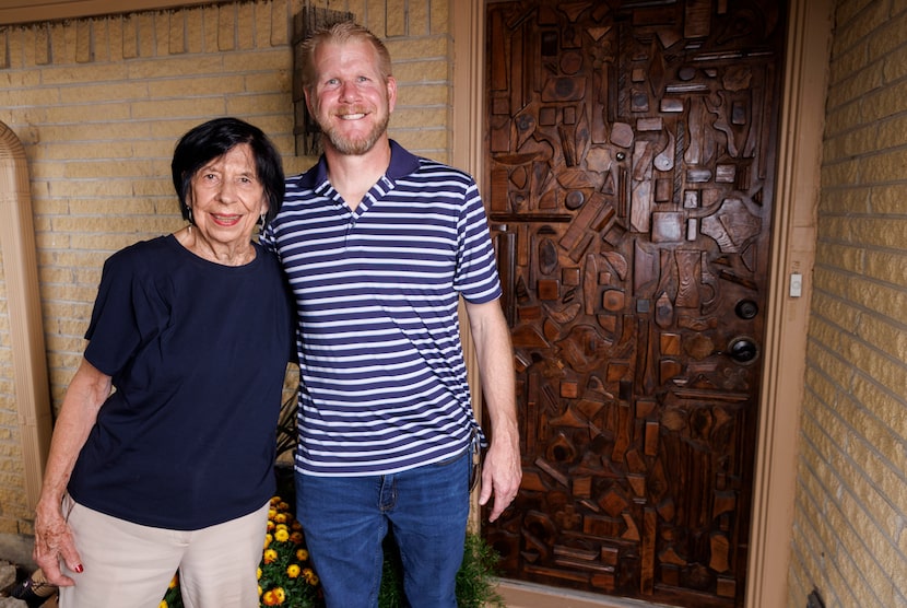 Bonnye Sherman with Jeremiah Dee outside her home in front of the front door he restored for...