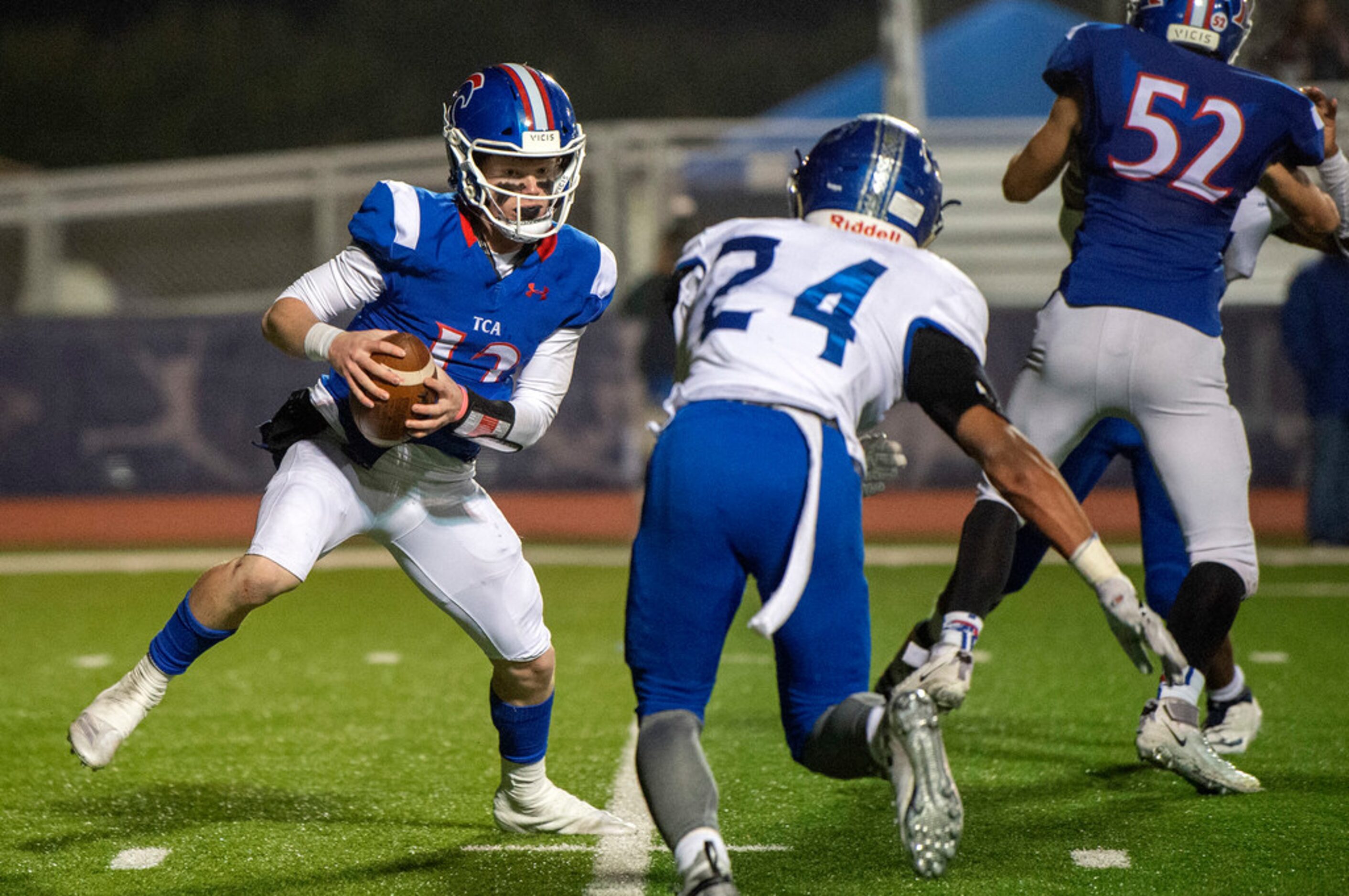 TCA-Addison junior quarterback Conner Williams (12) tries to elude Fort Worth Nolan senior...