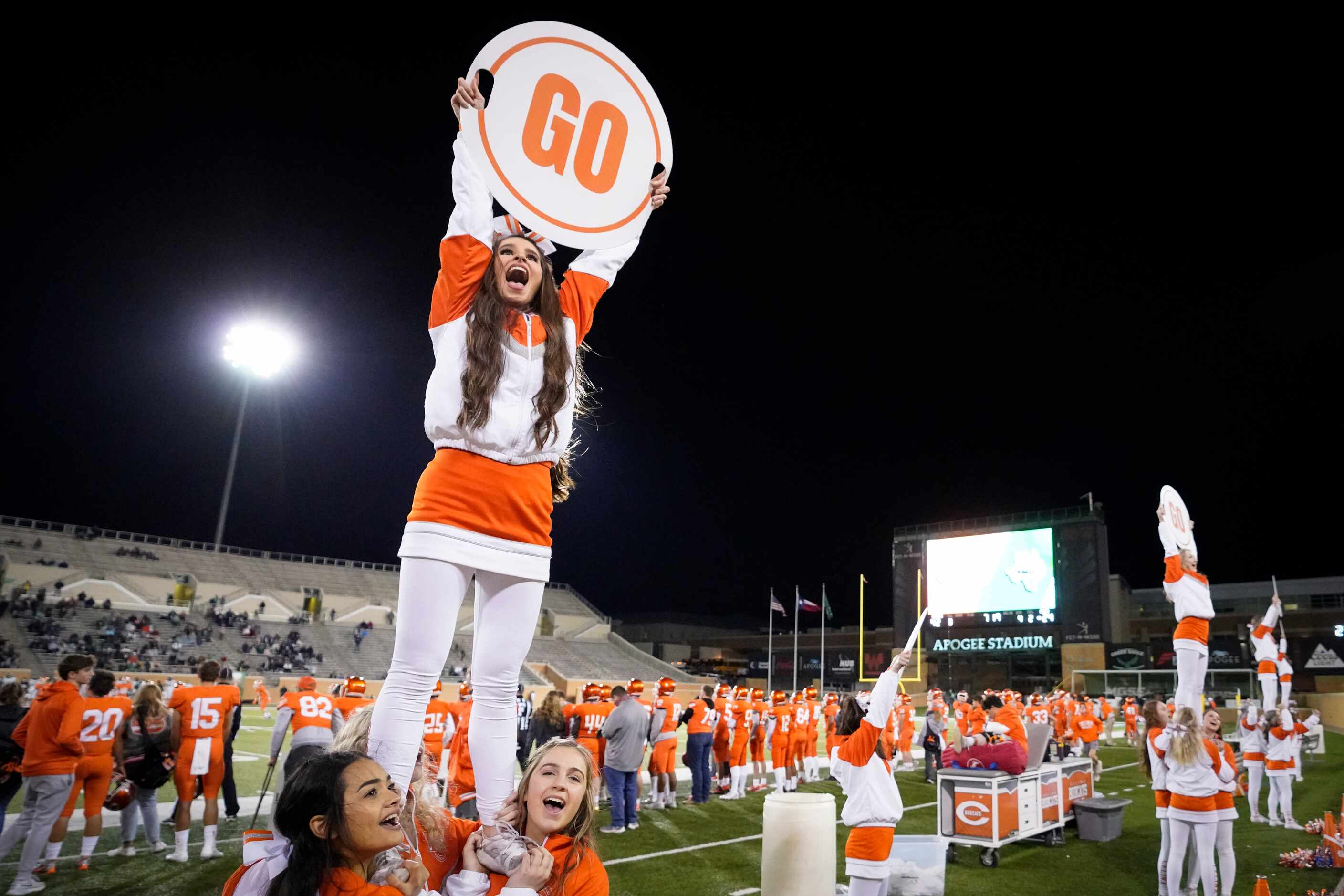 Celina cheerleaders yell for their team during the second half of a 42-24 victory over Iowa...