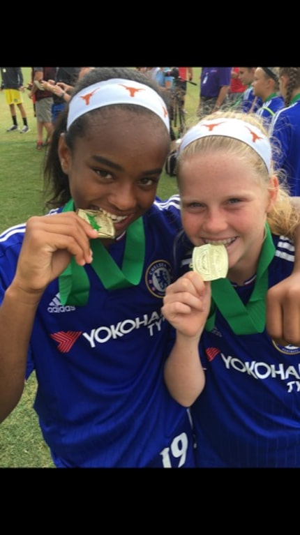 Trinity Byars (left) and Alexis "Lexi" Missimo celebrate winning a national championship...