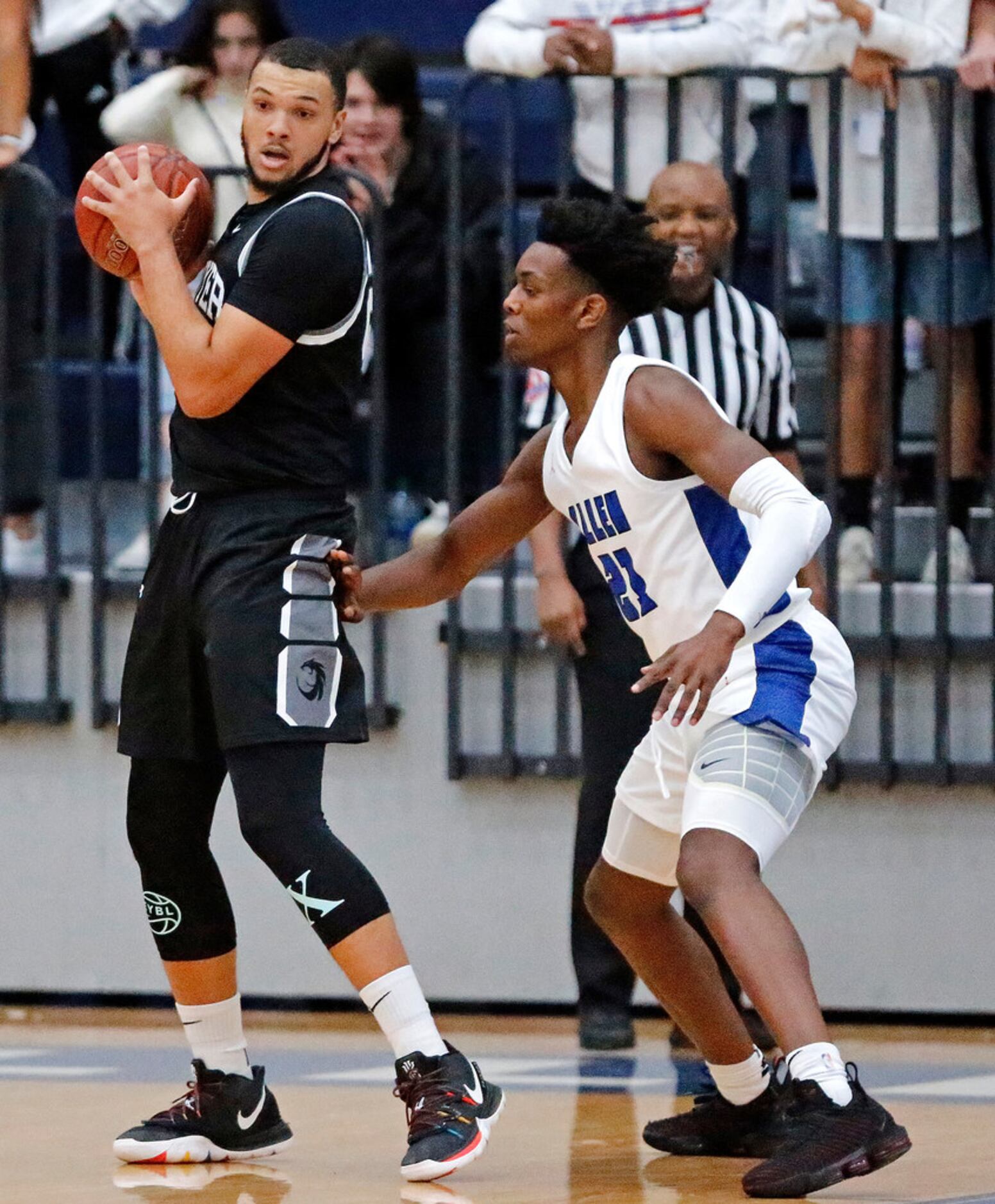 Denton Guyer High School JaKobe Coles (24) prepares to make a move toward the basket as he...