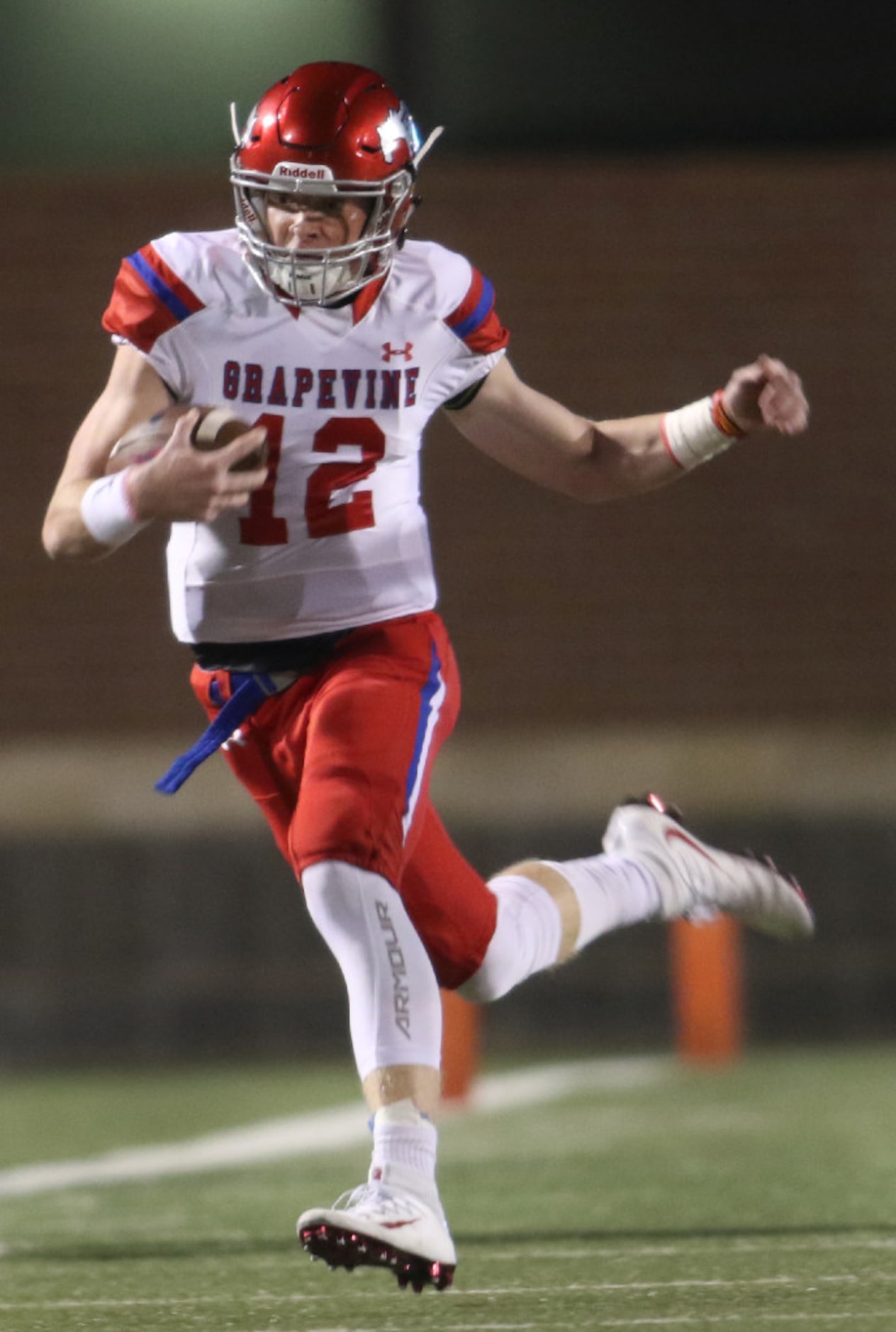 Grapevine quarterback Alan Bowman (12) rambles for a first down on a keeper during the first...