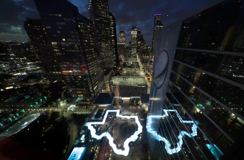 A pool in the shape of Texas is illuminated at the Marriott Marquis Houston, the NFL...