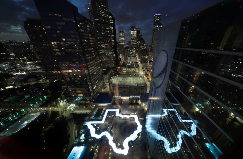 A pool in the shape of Texas is illuminated at the Marriott Marquis Houston, the NFL...