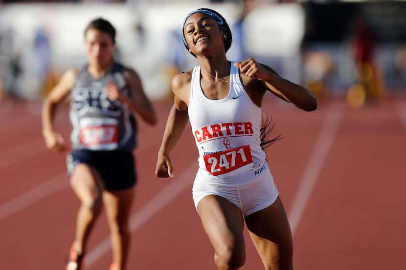 Dallas Carter's Sha'Carri Richardson (2471) finishes first in the class 4A girls 100-meter...