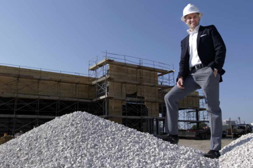 Matt Stinson, chief executive of Roundtree Automotive Group, stands at the construction site...