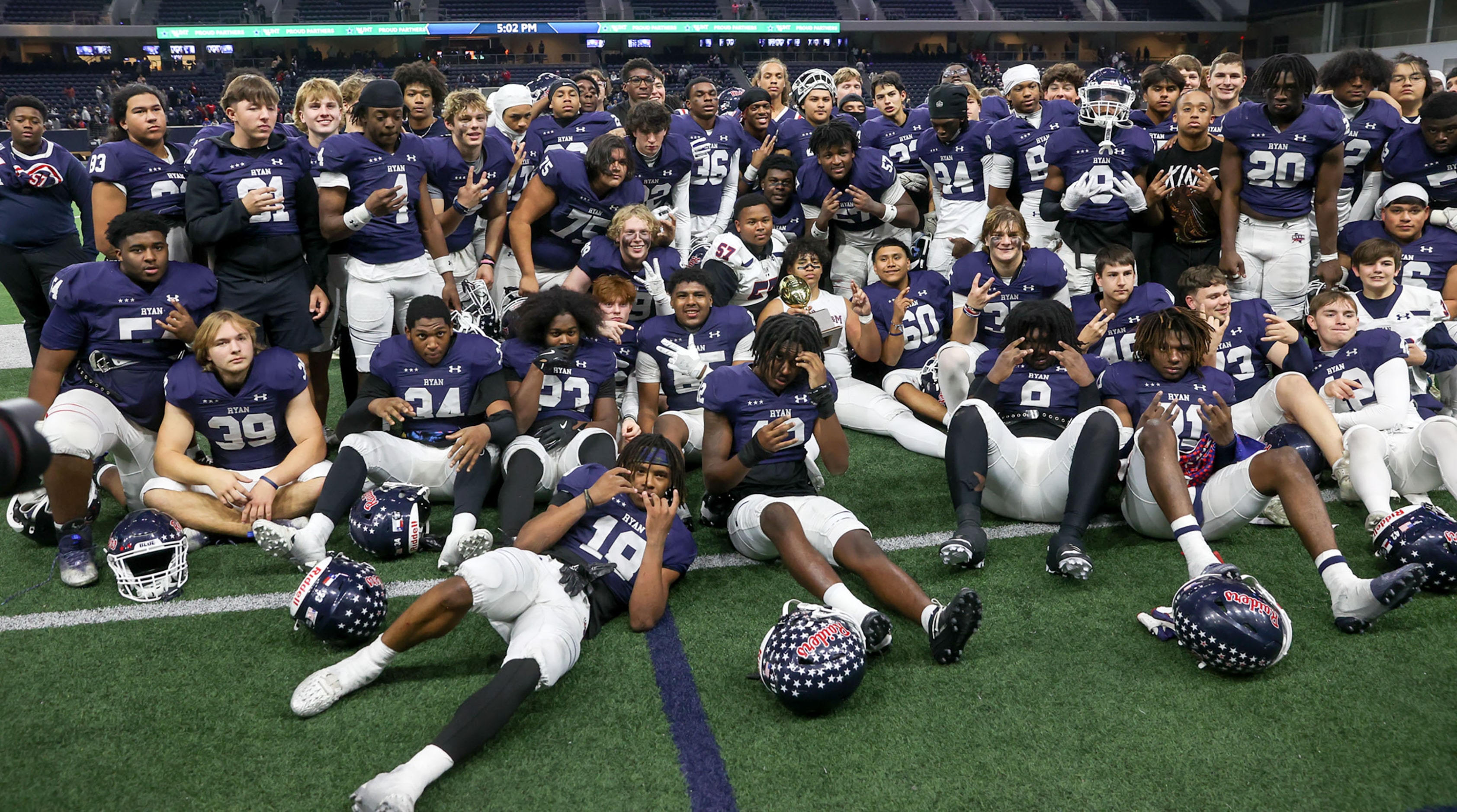 The Denton Ryan Raiders pose for a team photo after beating Richland, 48-35 in a Class 5A...