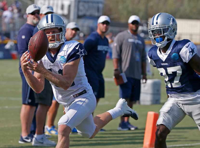Dallas Cowboys wide receiver Cole Beasley (11) pulls in a pass over cornerback Jourdan Lewis...