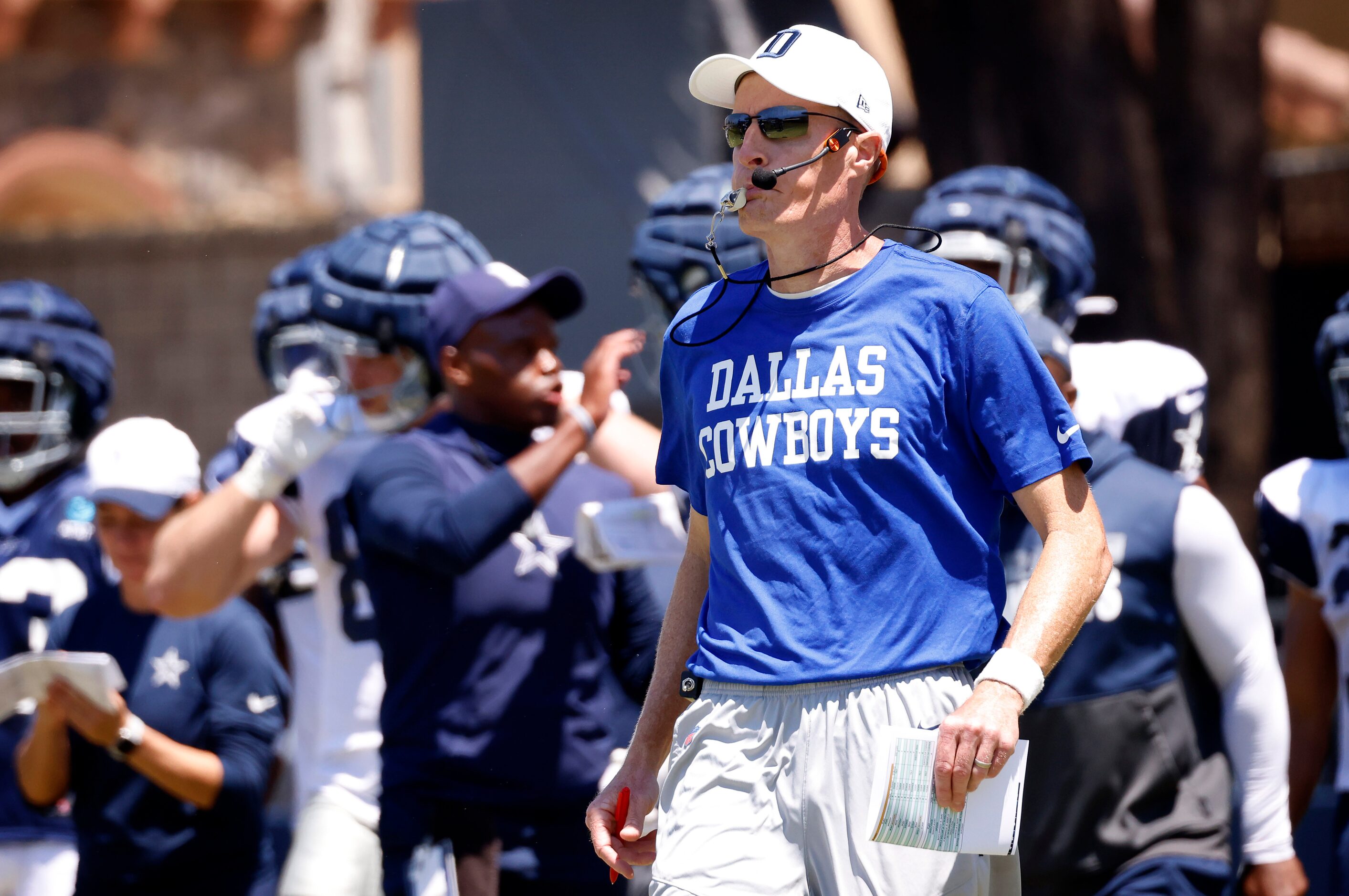 Dallas Cowboys special teams coach John Fassel blows his whistle as the offense squares off...