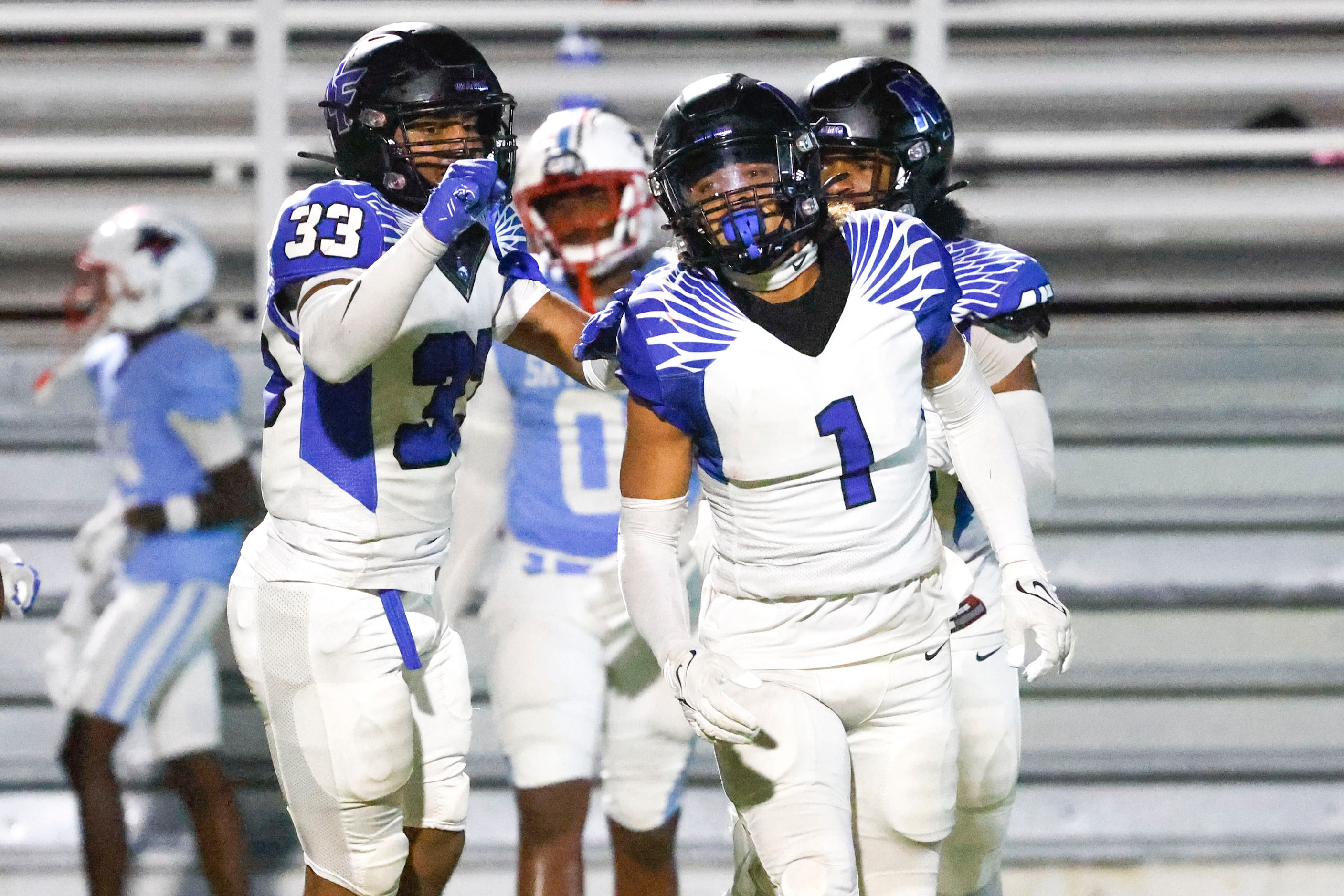 North Forney High’s Caleb Holt (1) celebrates after gaining a yardage against Skyline High...