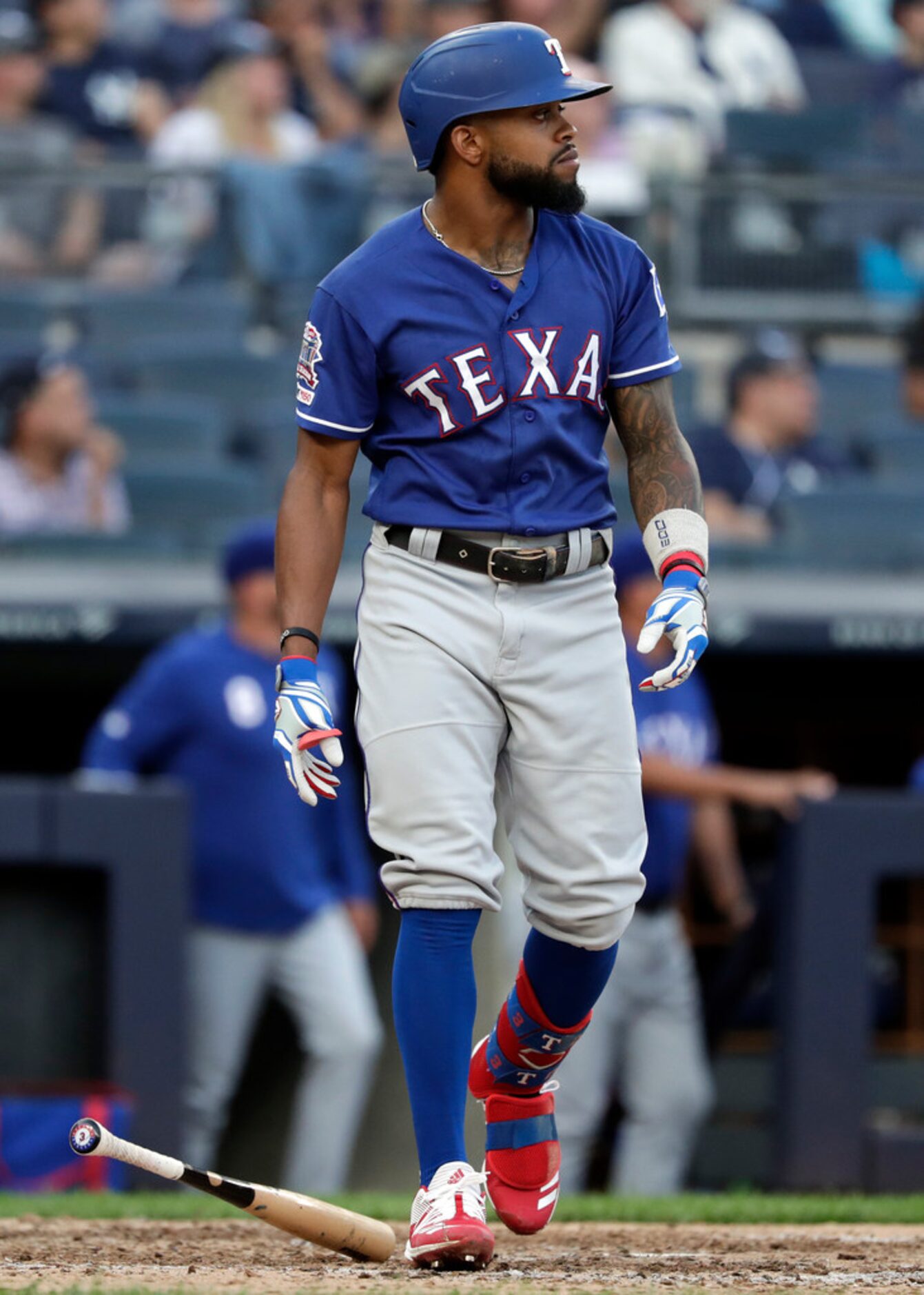 Texas Rangers' Delino DeShields watches his three-run home run during the eighth inning of a...