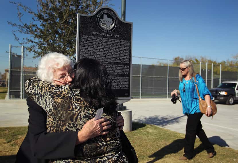 Marie Tippit hugged her daughter, Brenda Tippit, following the dedication ceremony for the...