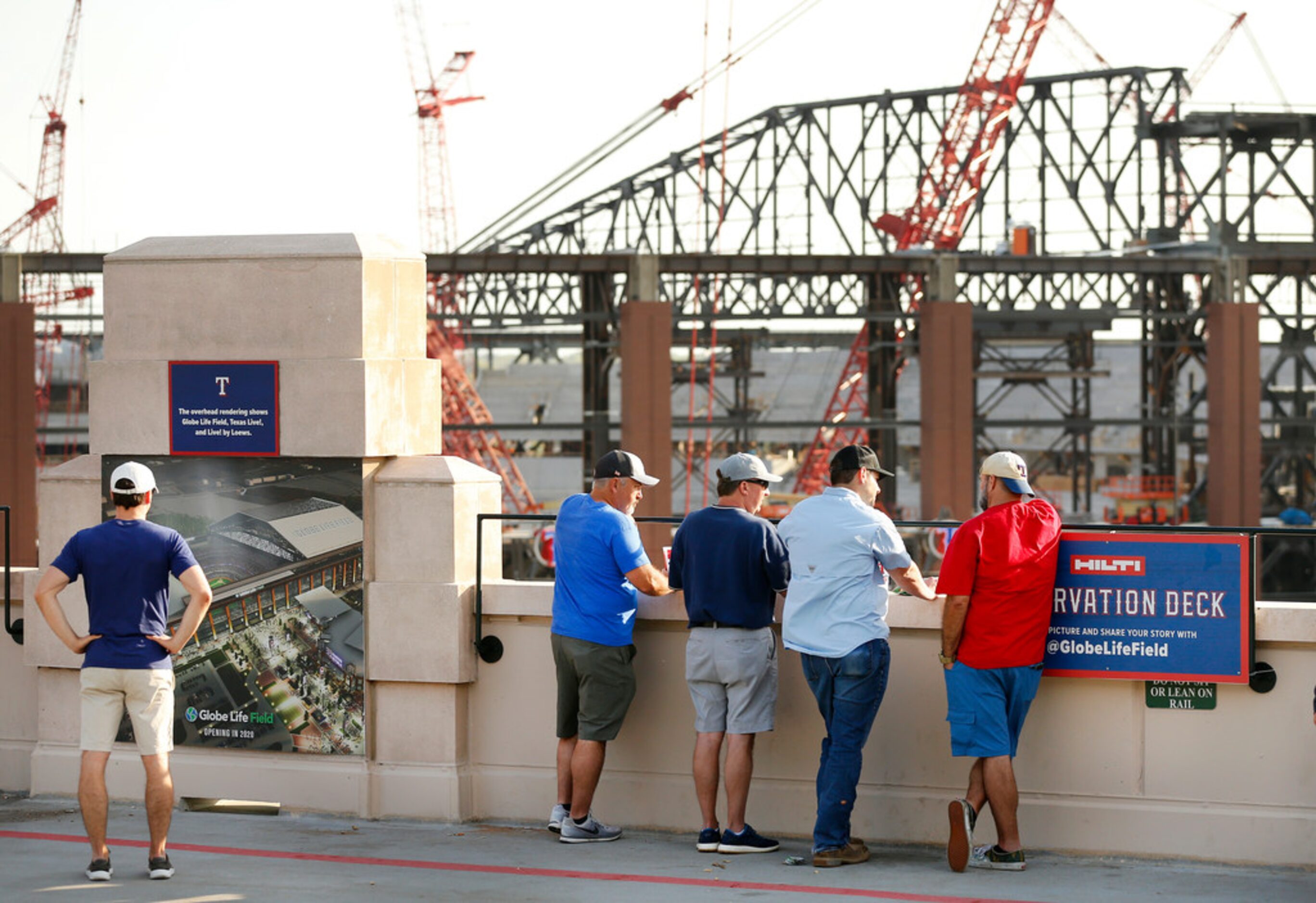 Texas Rangers fans view the new Globe Life Field under construction across from the Globe...