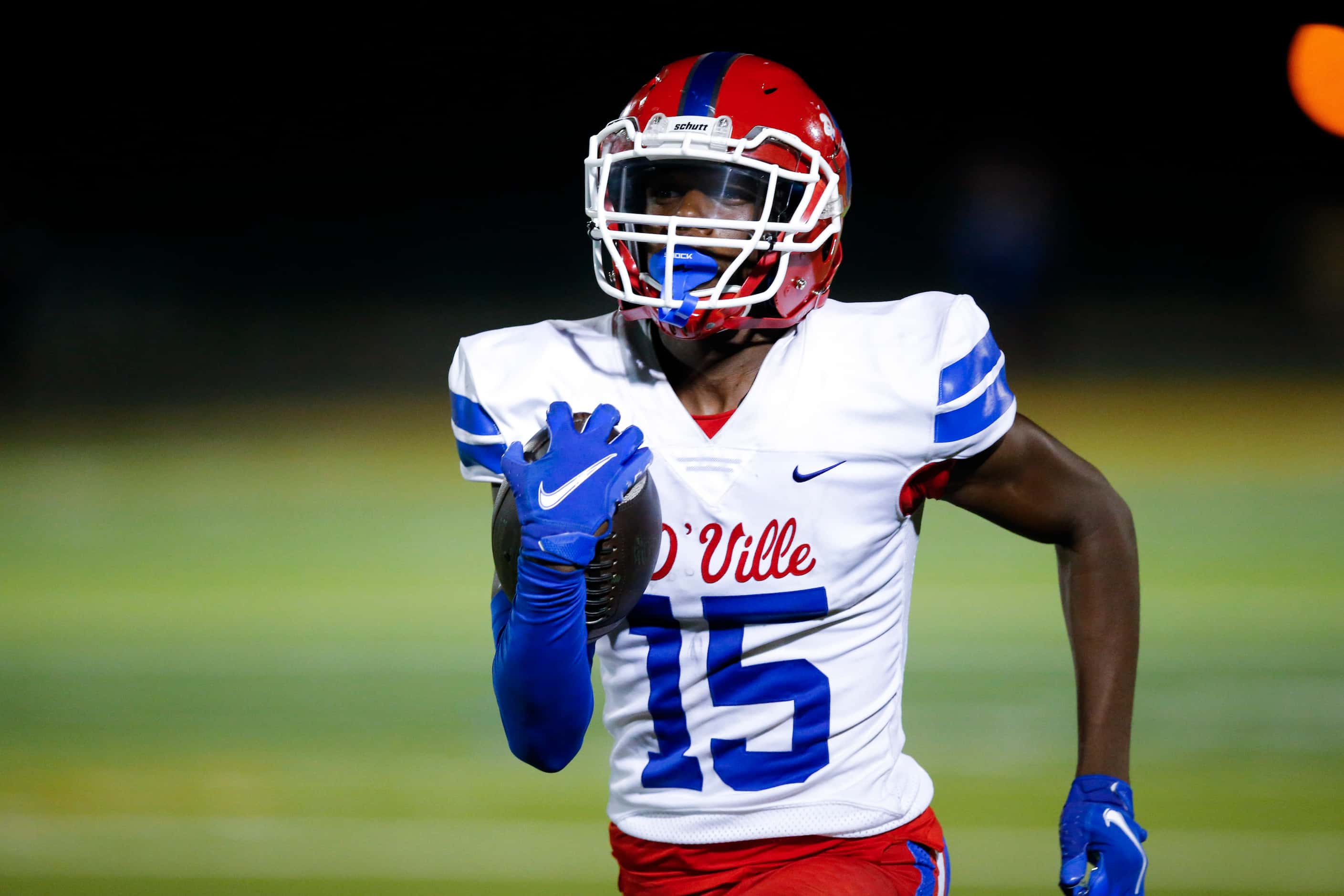 Duncanville junior defensive back Lamoderick Spencer carries the ball in for a touchdown...
