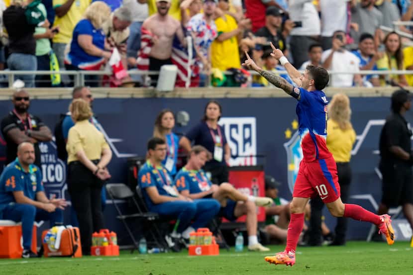 U.S. forward Christian Pulisic (10) celebrates his goal against Brazil on a free kick during...